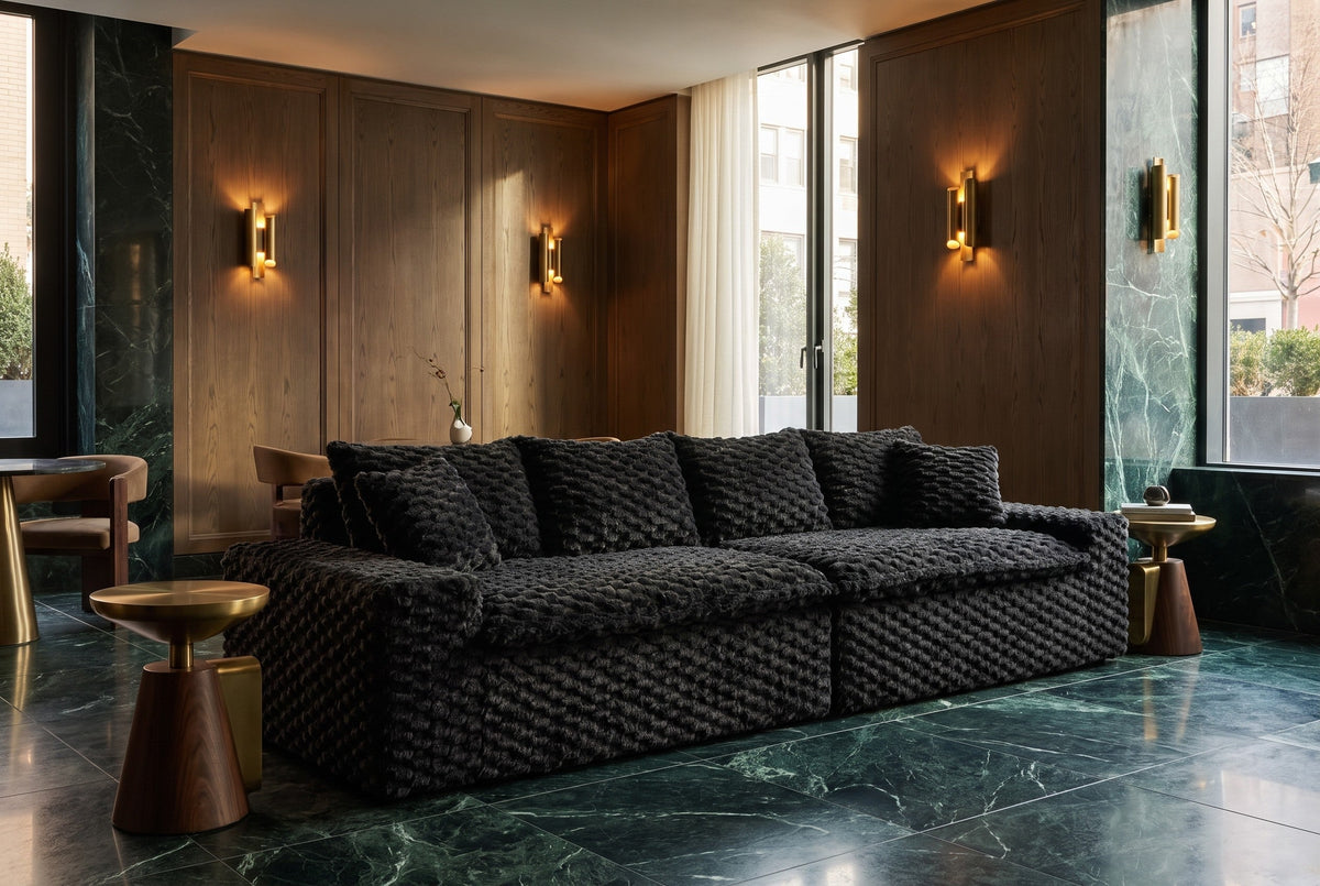 What is a modular sofa: a black velvet modular sofa in two sections