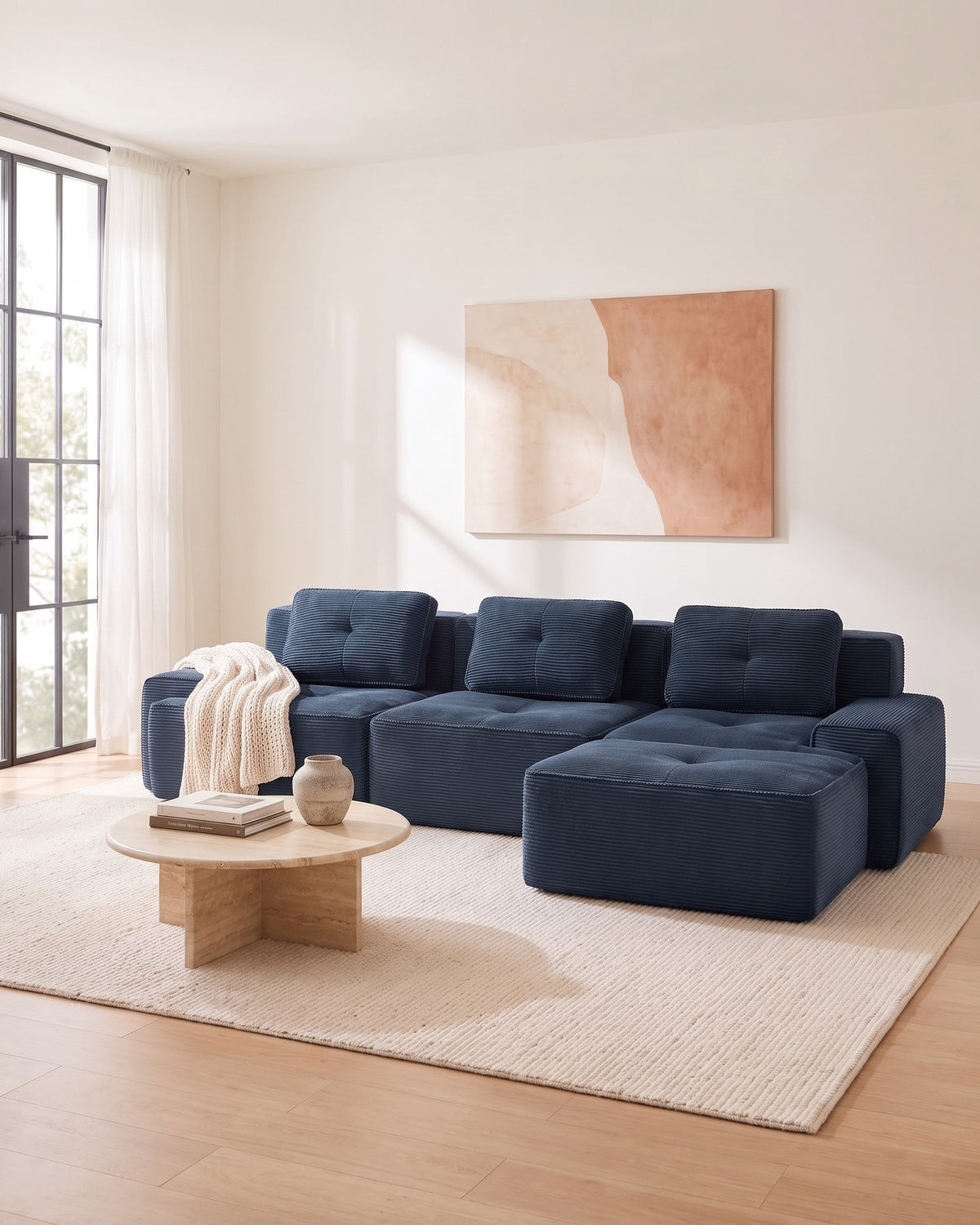 Blue Tufted Corduroy Sectional with Ottoman, 117 in in Blue, styled in a bright living room