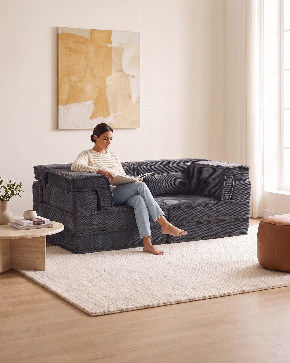Boneless Compression Loveseat, 79 in in Dark Grey, with a person relaxing on it