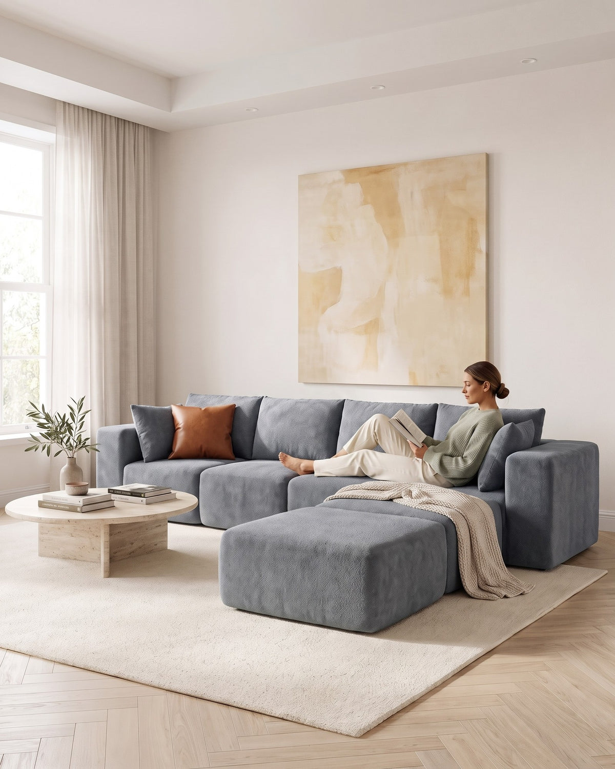 Boneless U-Shaped Sectional with Two Ottomans, 116 in in Dark Grey, with a person relaxing on it