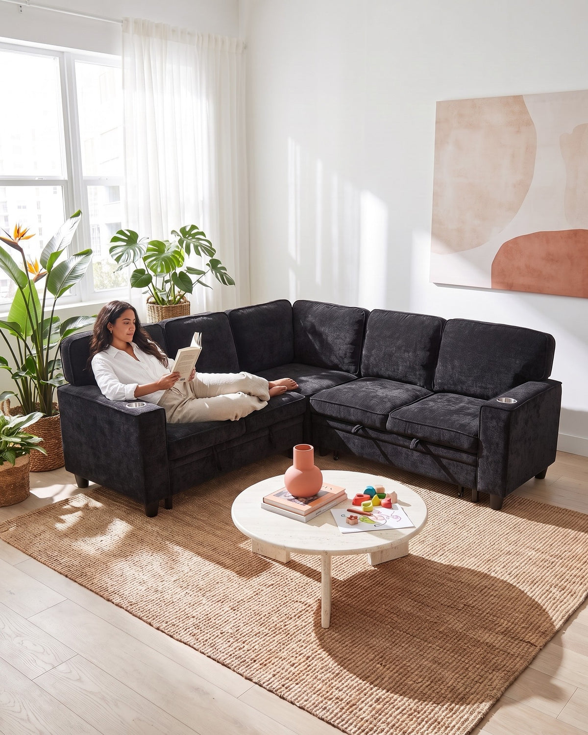 Chenille Sleeper Sectional with Pull-Out Bed and Storage, 81 in in Charcoal, with a person relaxing on it