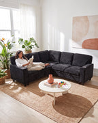 Chenille Sleeper Sectional with Pull-Out Bed and Storage, 81 in in Charcoal, with a person relaxing on it [c:charcoal] [r:comfort]
