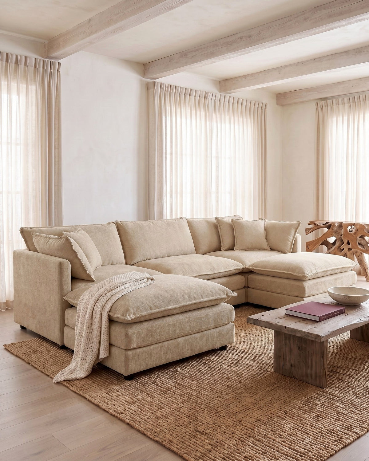 Chenille U-Shaped Sectional with 2 Reversible Ottomans, 3 Seats in Beige, styled in a bright living room