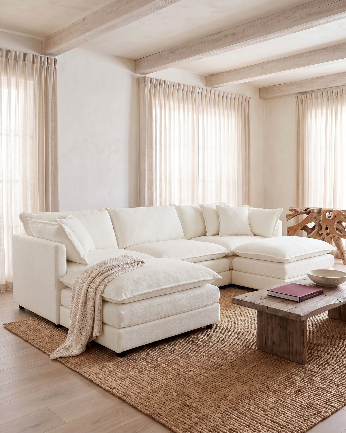 Chenille U-Shaped Sectional with 2 Reversible Ottomans, 3 Seats in White, styled in a bright living room