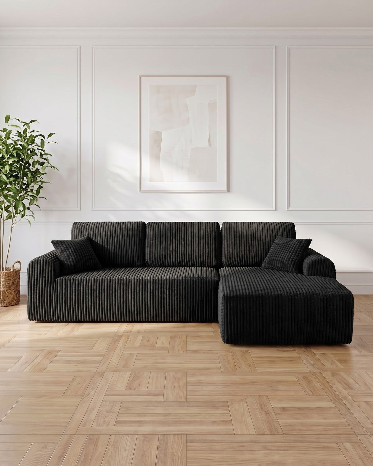 Cloud Modular L-Shaped Sectional with Chaise, 109 in in Black, chaise on the left, styled in a bright living room