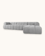Compressed L-Shaped Sectional with Chaise, 122 in in Grey, studio photo on a light background [c:grey] [pack]