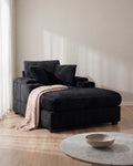 Corduroy Chair and a Half with Storage Arms and Ottoman in Black, styled in a bright living room [c:black] [r:good]