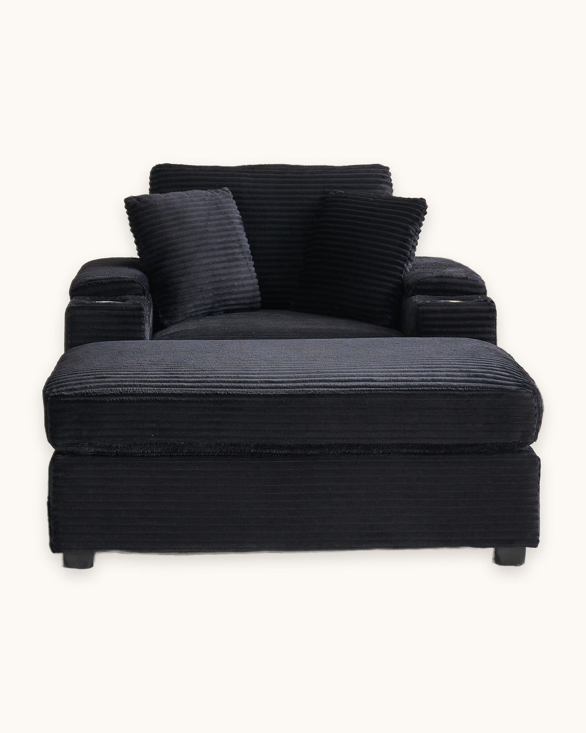 Corduroy Chair and a Half with Storage Arms and Ottoman in Black, studio photo on a light background