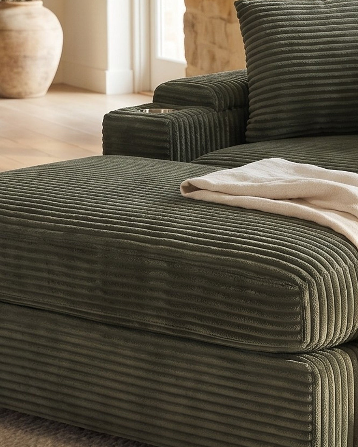 Corduroy Chair and a Half with Storage Arms and Ottoman in Dark Green, close-up of the left end