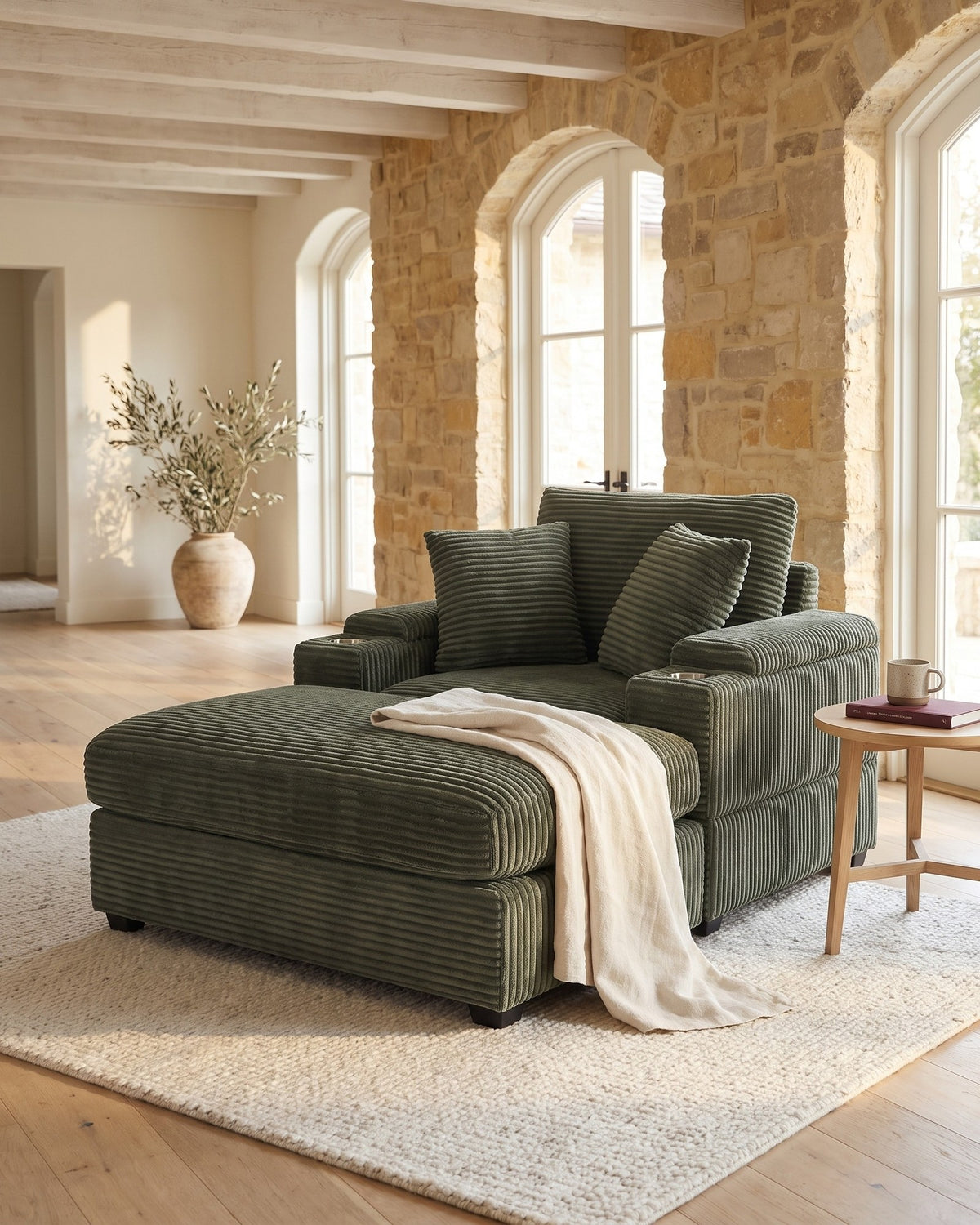 Corduroy Chair and a Half with Storage Arms and Ottoman in Dark Green, styled in a bright living room