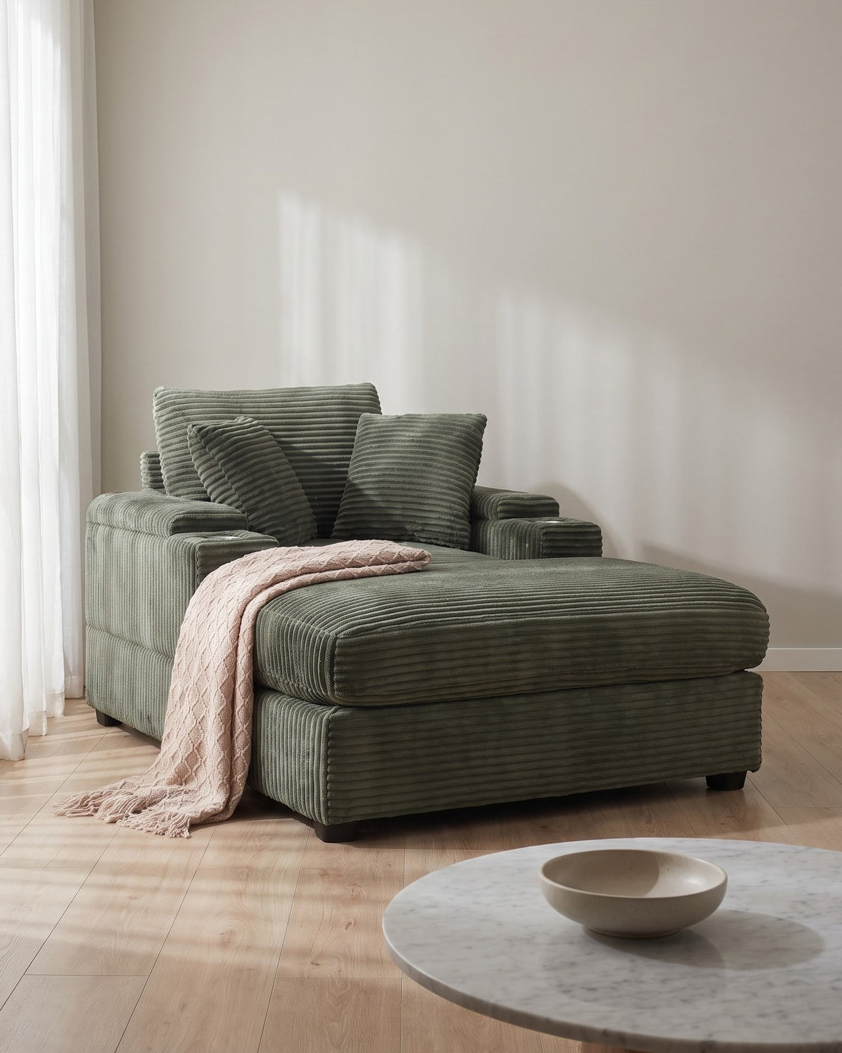 Corduroy Chair and a Half with Storage Arms and Ottoman in Dark Green, styled in a bright living room