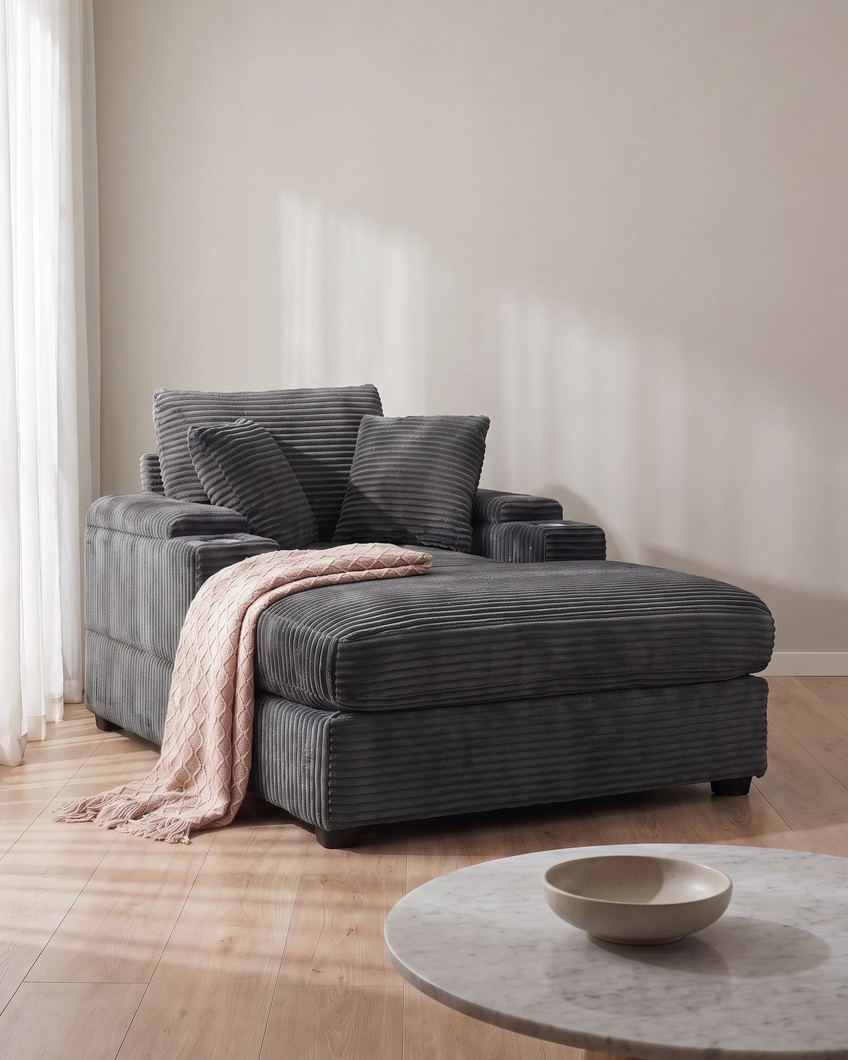Corduroy Chair and a Half with Storage Arms and Ottoman in Grey, styled in a bright living room