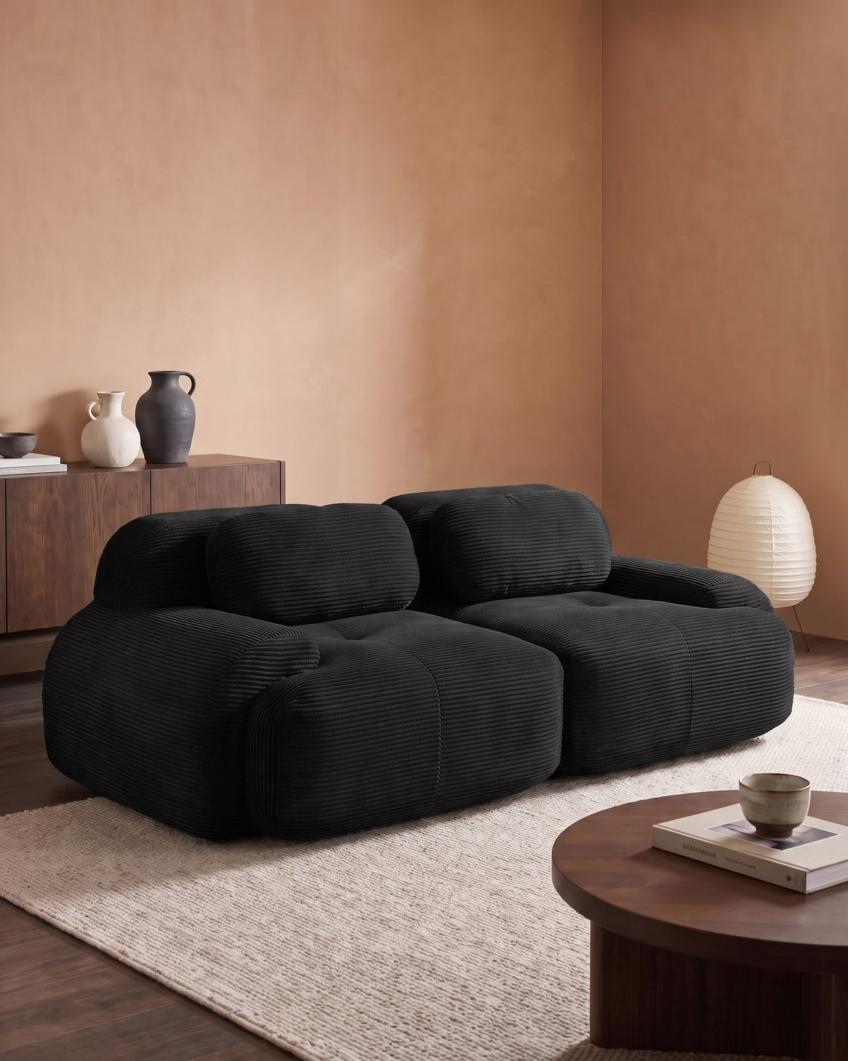 Corduroy Modular Loveseat, 82 in in Black, styled in a bright living room