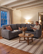 Corduroy Sleeper Sectional with Pull-Out Bed and Storage, 81 in in Grey, with a person relaxing on it [c:grey] [r:comfort]