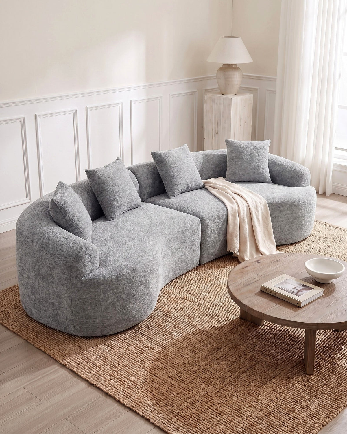 Curved Boneless Sofa, 110 in in Grey, styled in a bright living room