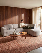 Curved Deep-Seat Sectional with Ottoman, 111 in in Espresso, with a person relaxing on it [c:espresso] [r:comfort]