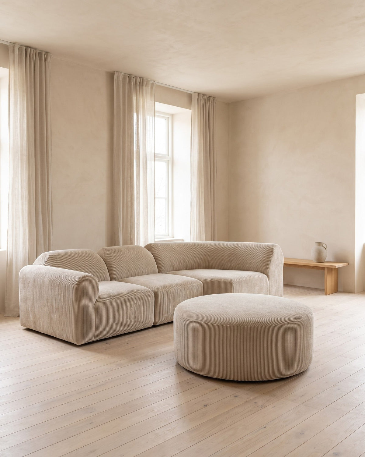 Curved Deep-Seat Sectional with Ottoman, 111 in in Espresso, styled in a bright living room