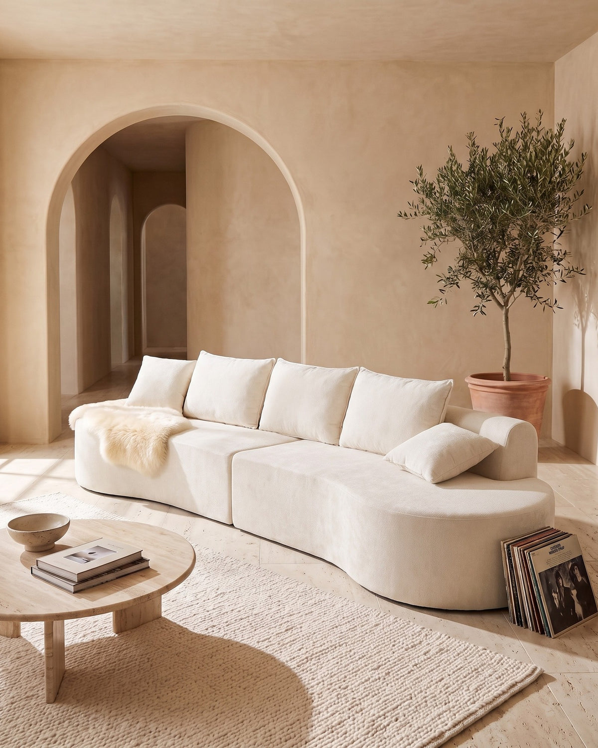 Curved Sectional, 139 in in Beige, styled in a bright living room