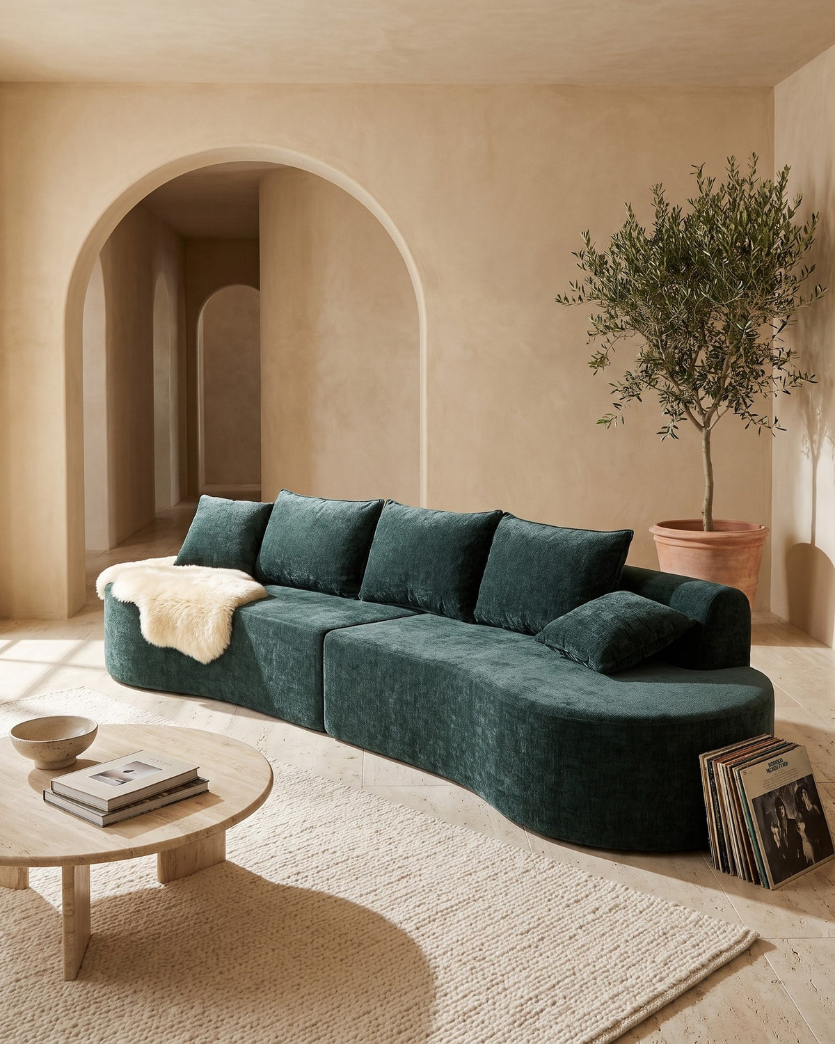 Curved Sectional, 139 in in Dark Green, styled in a bright living room