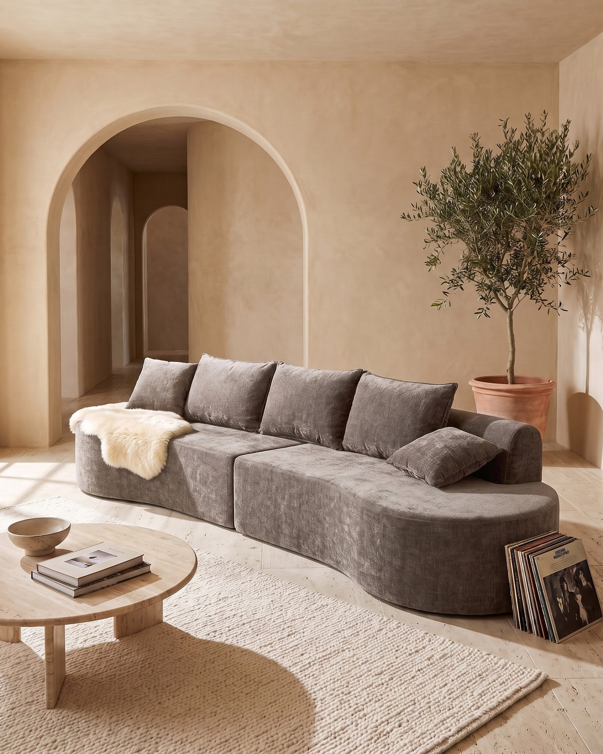 Curved Sectional, 139 in in Light Brown, styled in a bright living room