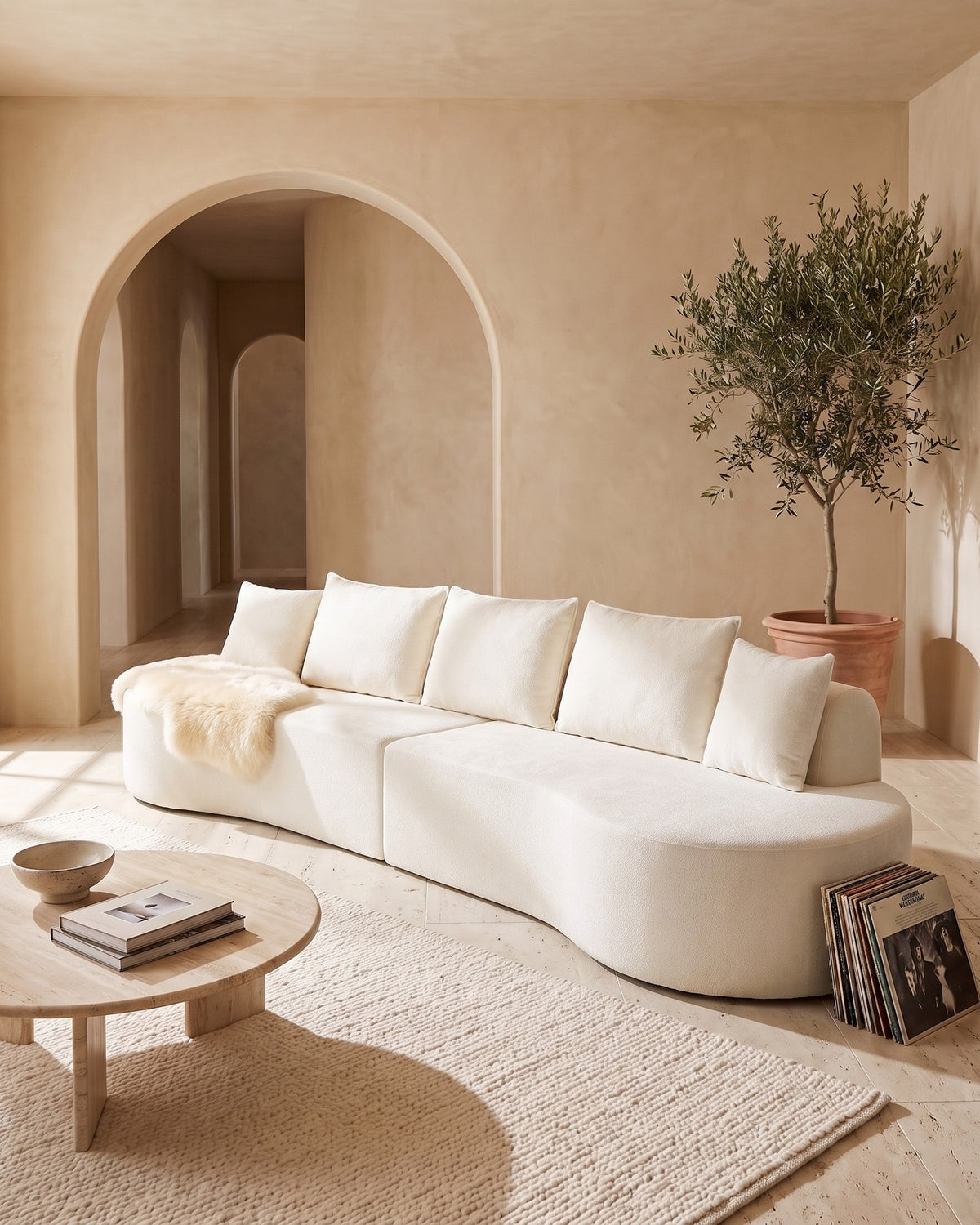 Curved Sectional, 139 in in White, styled in a bright living room