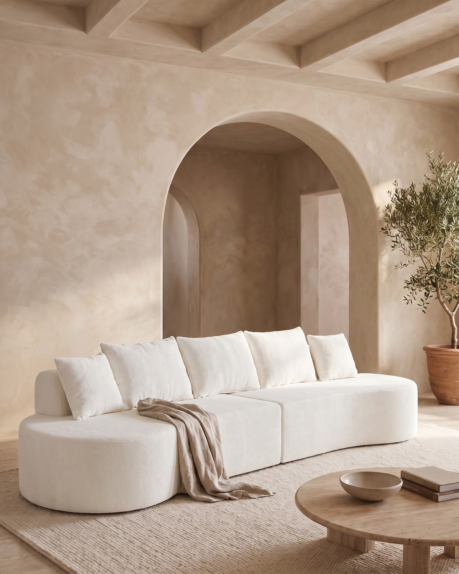 White curved modular sectional in a bright living room