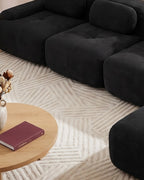 Modular Sofa with Reversible Ottoman, 4 Seats in Black, close-up of the left end [c:black] [r:detail]