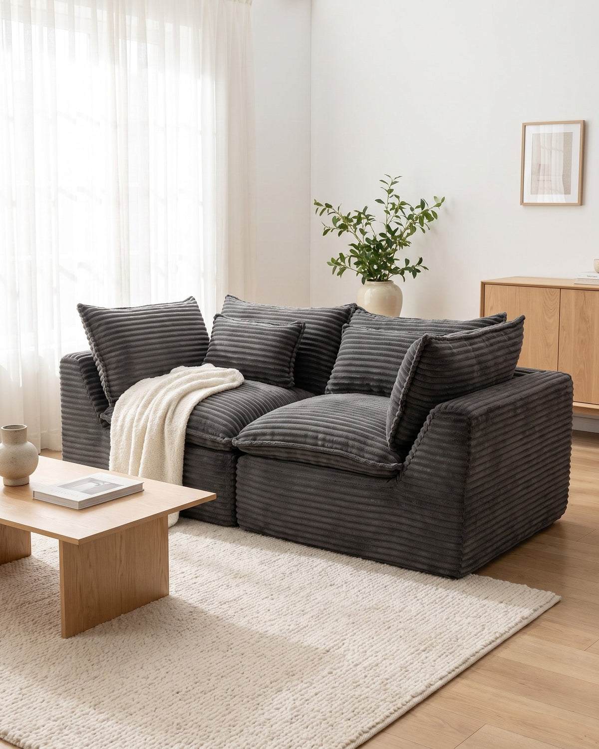 Oversized Cloud Loveseat, 75 in in Antique Grey, styled in a bright living room