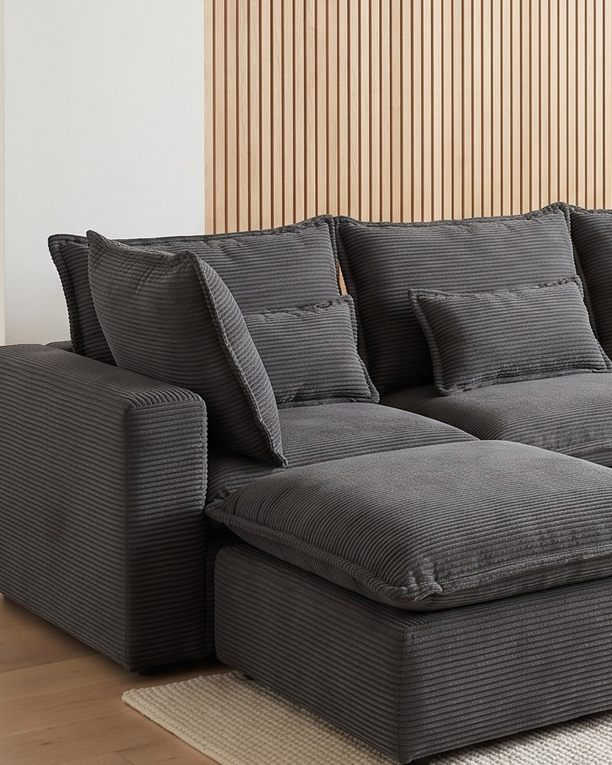Oversized Cloud U-Shaped Sectional with Ottomans, 130 in in Antique Grey, close-up of the left end