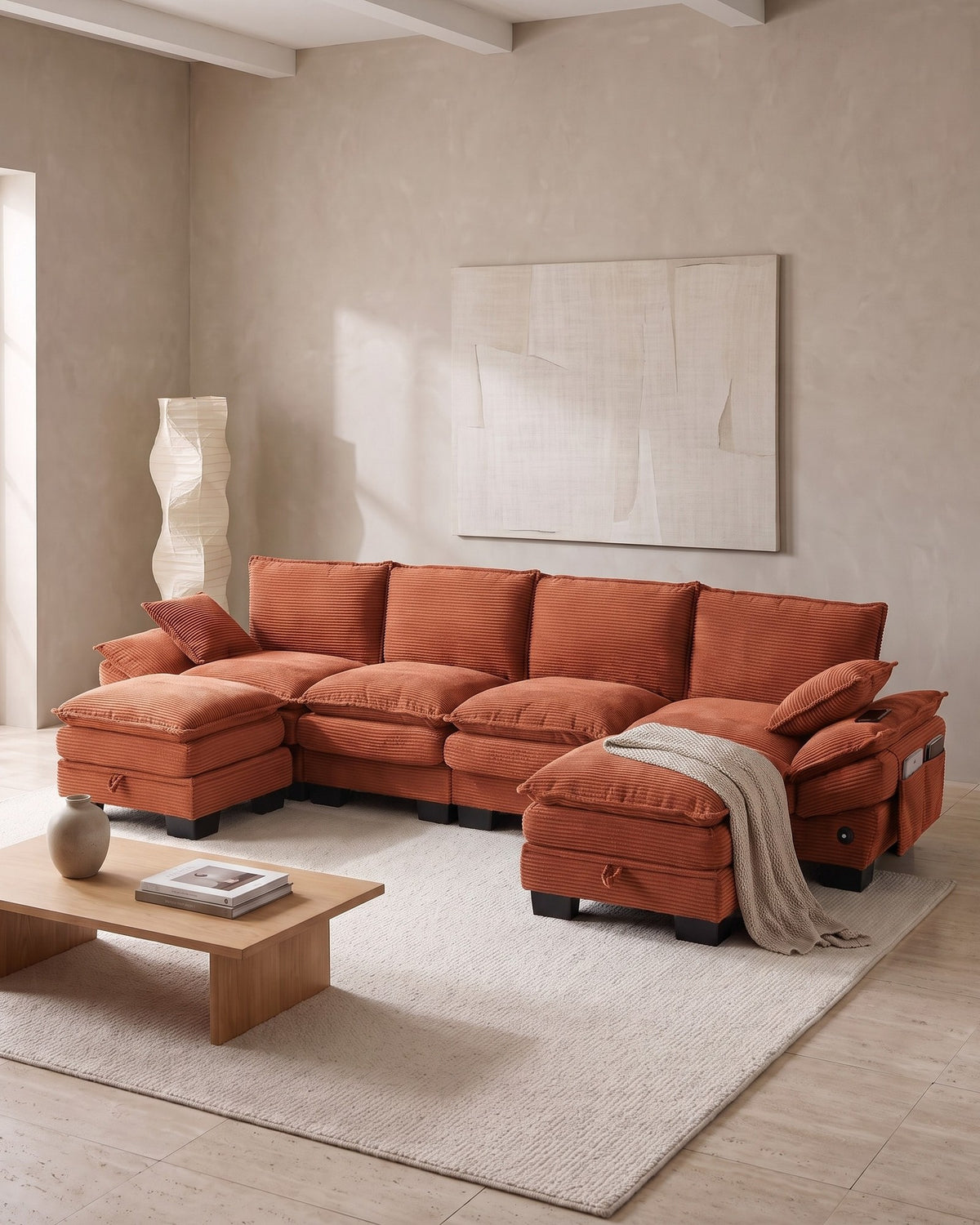 U-Shaped Corduroy Cloud Sectional with 2 Storage Ottomans, 130 in in Orange, styled in a bright living room