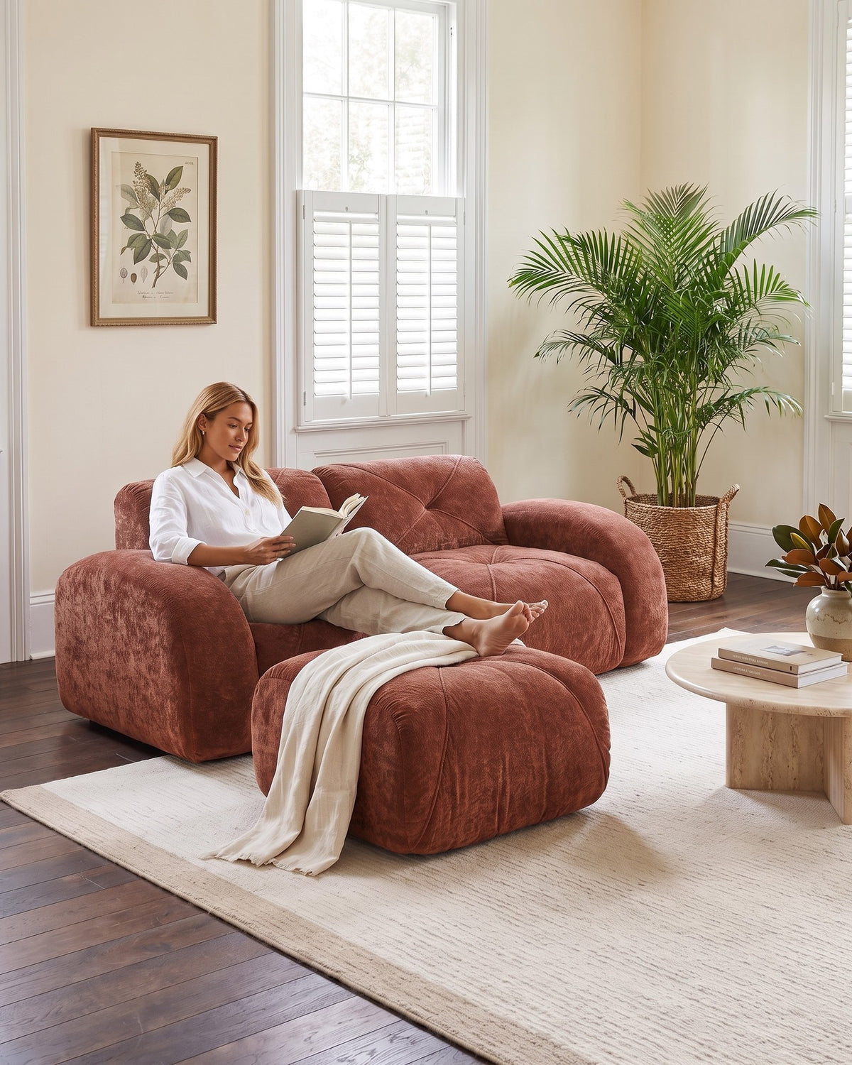 Velvet Boneless Loveseat with Ottoman, 80 in in Rust, with a person relaxing on it